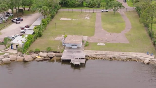 Actual property-film view toward shoreline structures and upland grounds